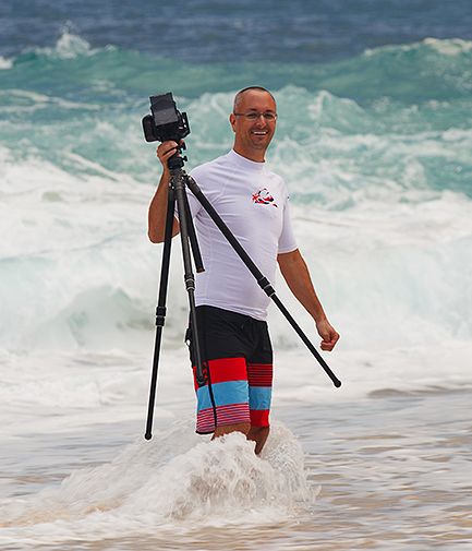 Jon Cornforth photographing surf on the North Shore of Oahu