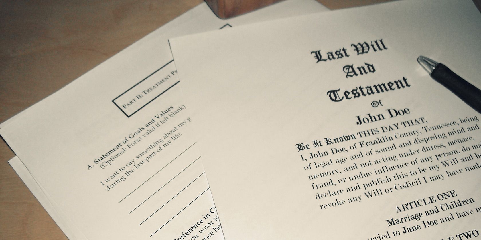 last will and testament on table with a pen