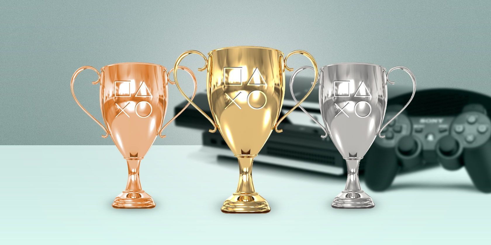 Gold, silver, and bronze trophy in front of a PS3 console and controller
