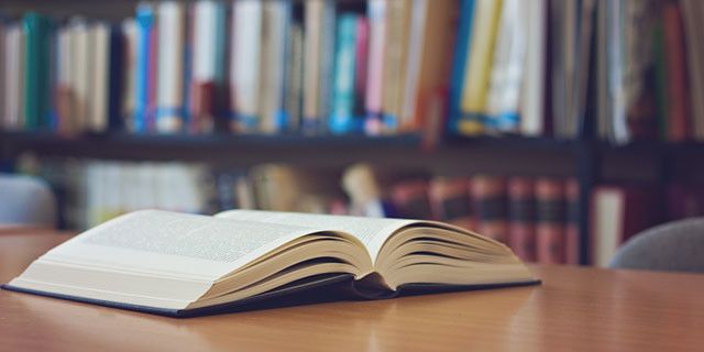 book on a desk in library