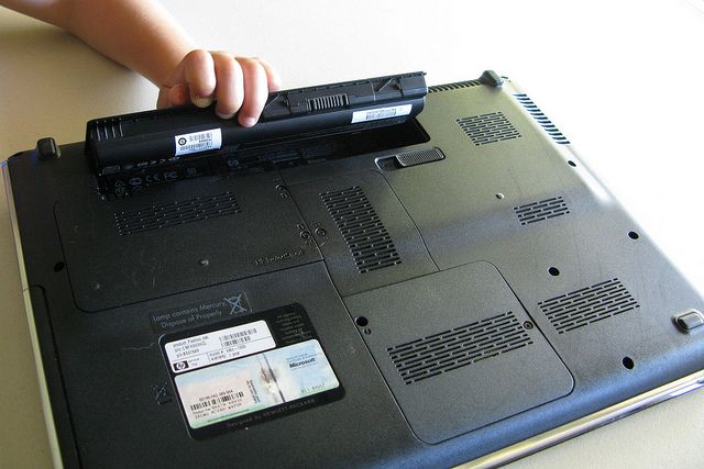 Child removing laptop battery