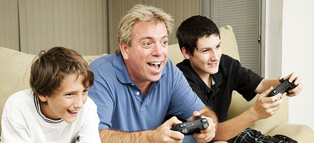 uncle plays video games with his nephews
