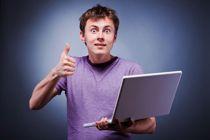 Guy Thumbs Up on Laptop