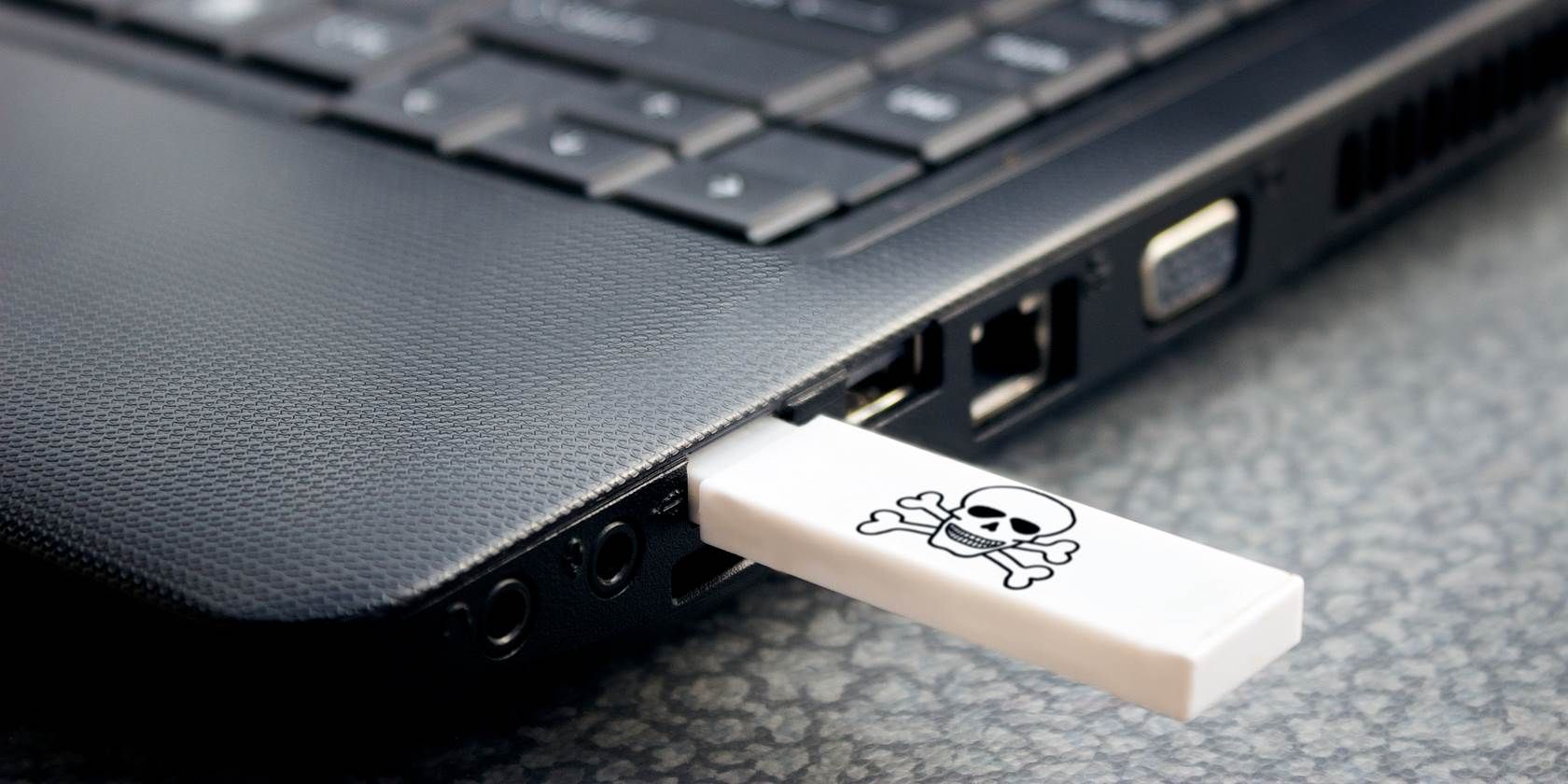 USB stick in a laptop, showing a skull and crossbones