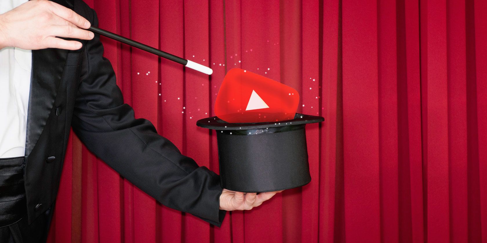 Magician holding a wand over a hat containing the YouTube logo