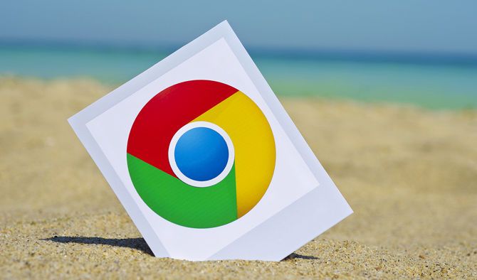 Chrome logo on photo in the sand