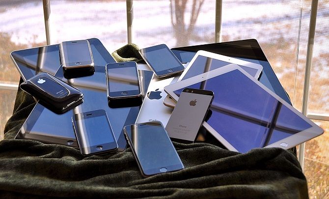 pile of smartphones and tablets
