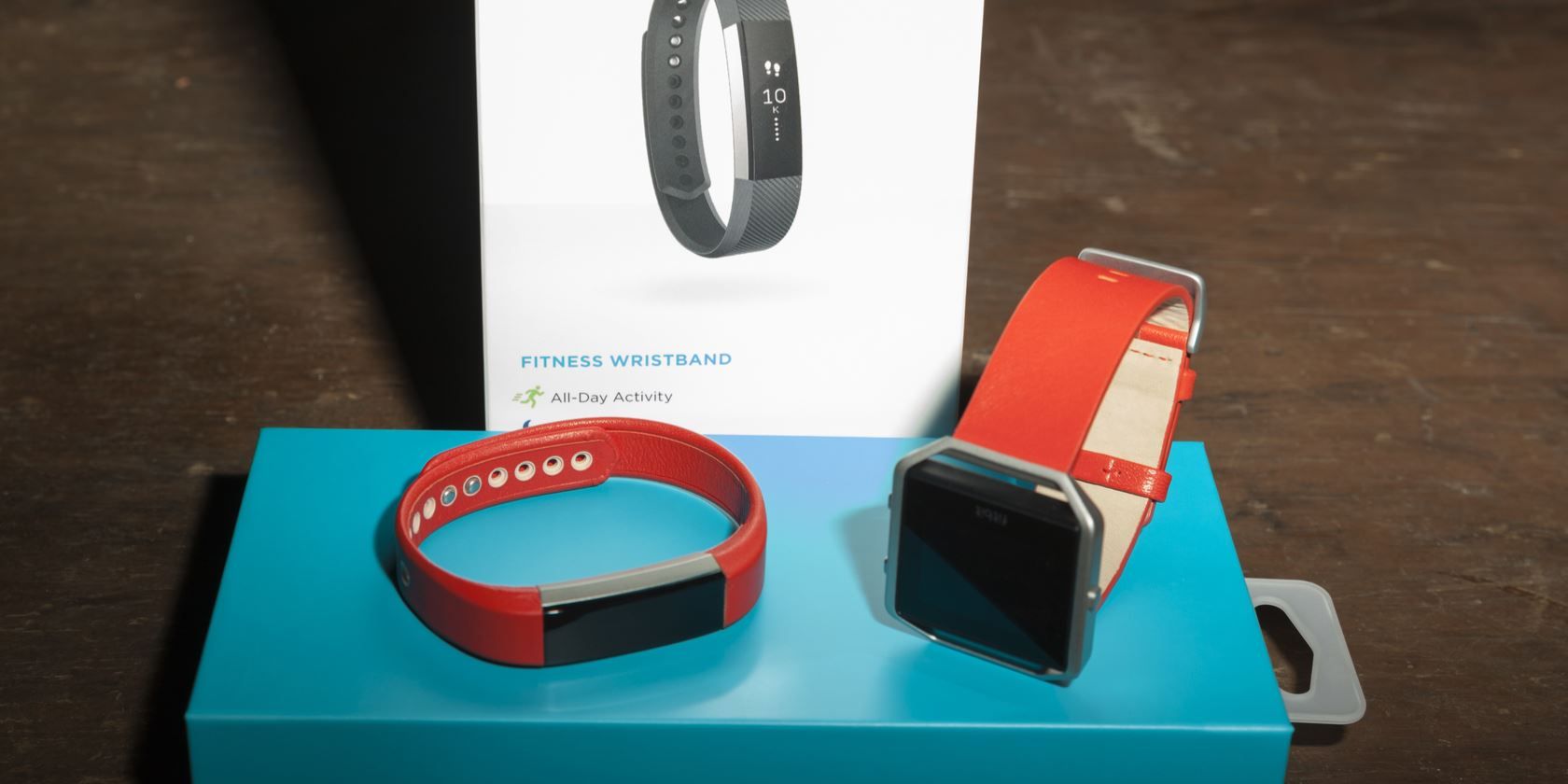 Fitbit devices on a Fitbit product box