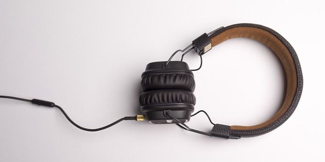 Wired headphones on a plain background