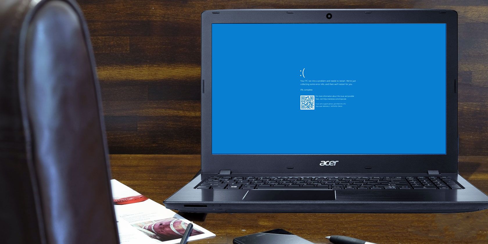 Windows 10 blue screen of death on a laptop sitting on a desk