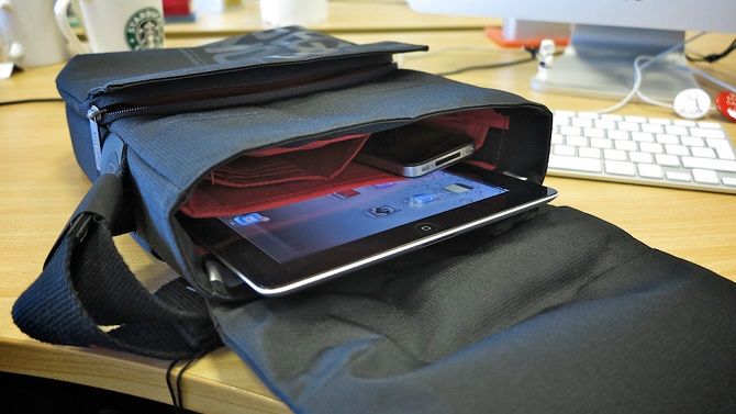 tablet sticking out of open bag