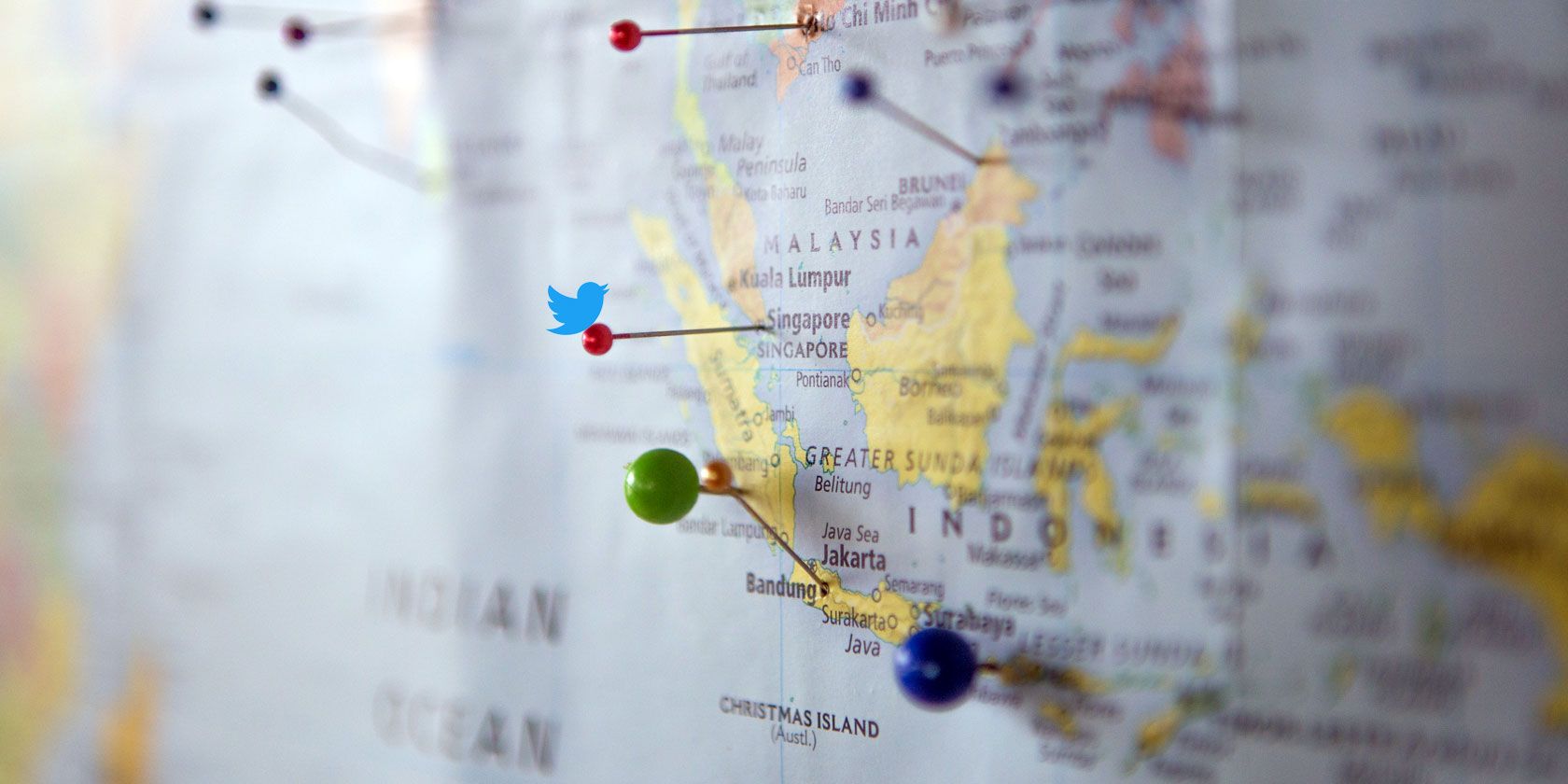 Photo showing Twitter logo on a world map