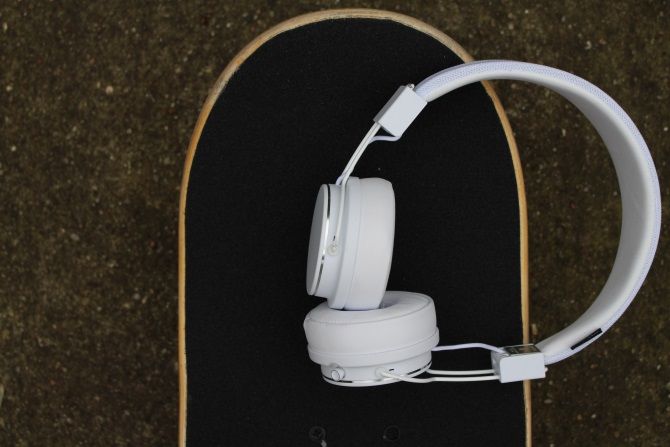 Urbanear Plattan 2 Bluetooth Headphones on a skateboard