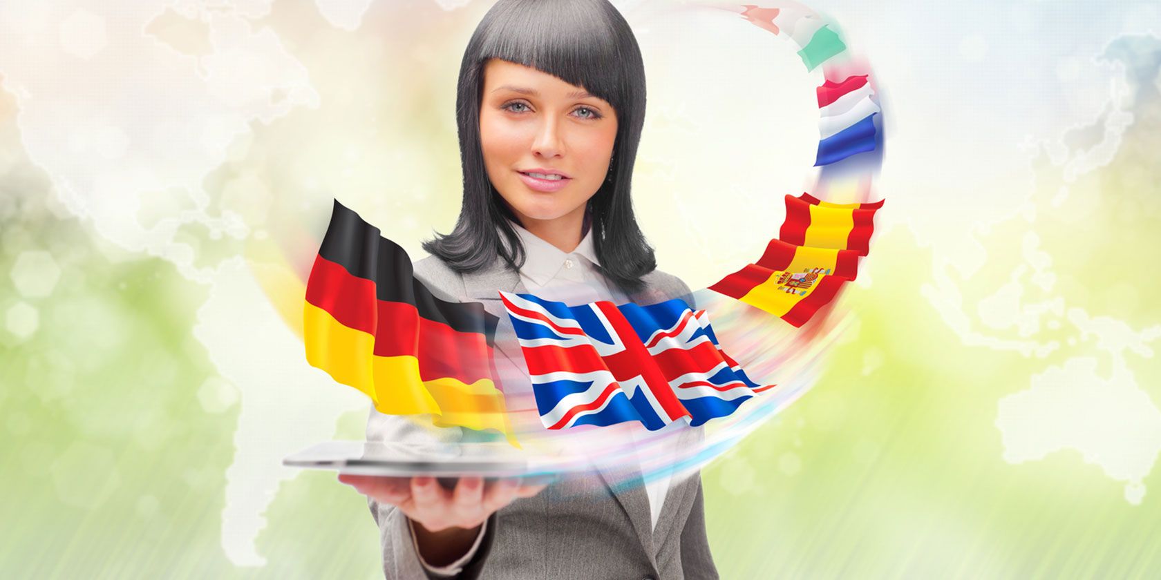 Woman holding tablet with country flags flying over it