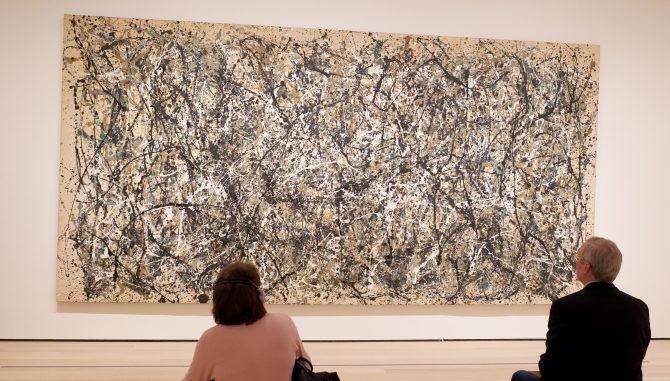 People viewing a Jackson Pollock painting