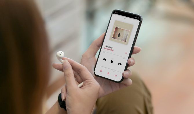 One AirPod removed to pause music