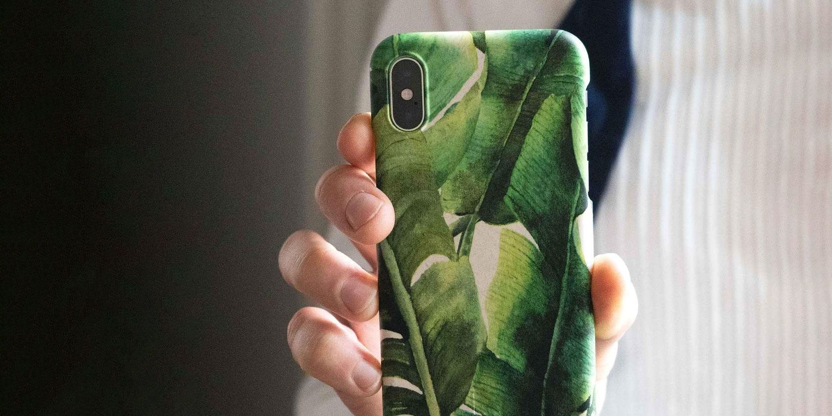 eco friendly phone case being held up in someone's hand