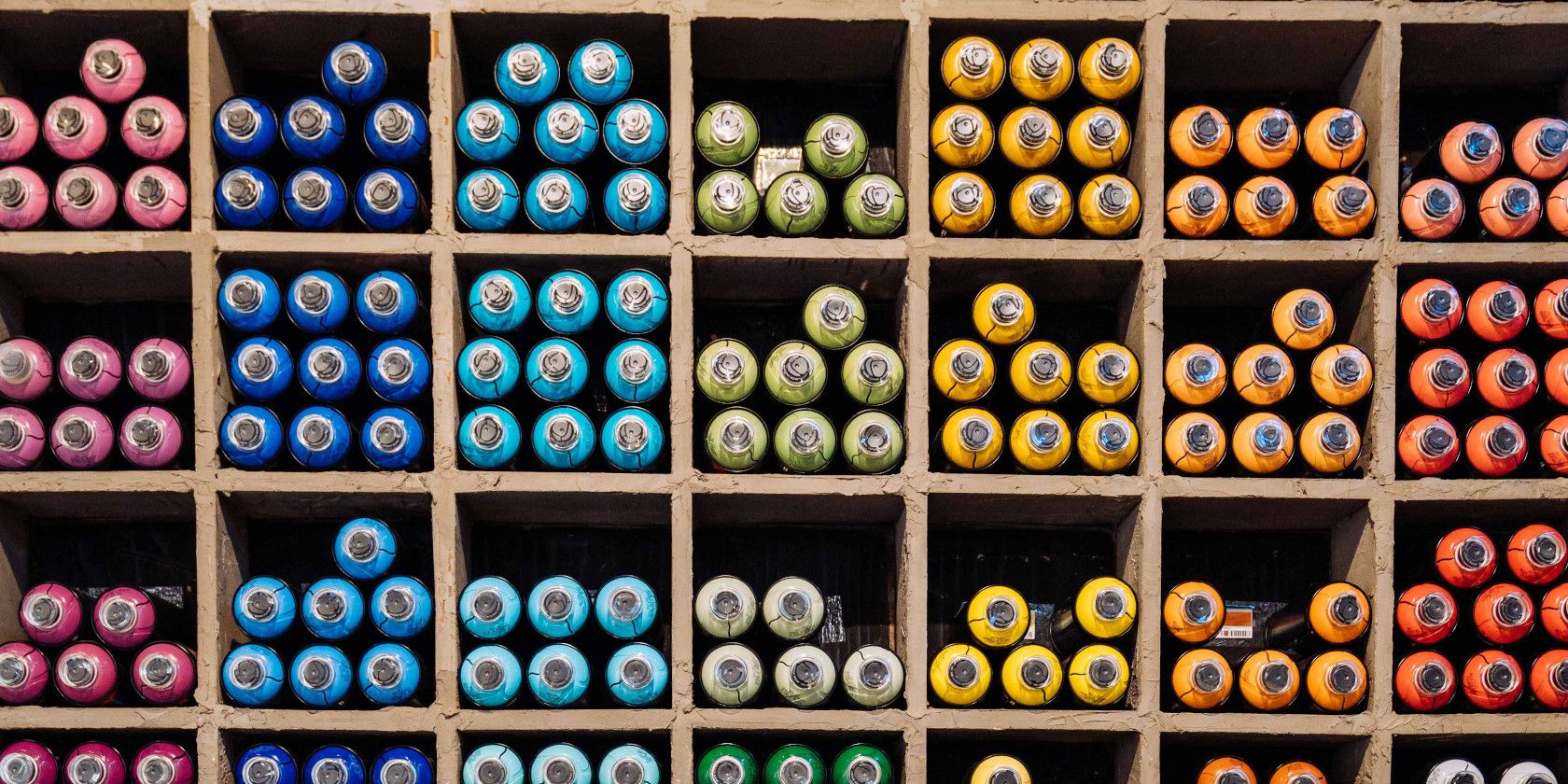 rolls of fabric organized by color