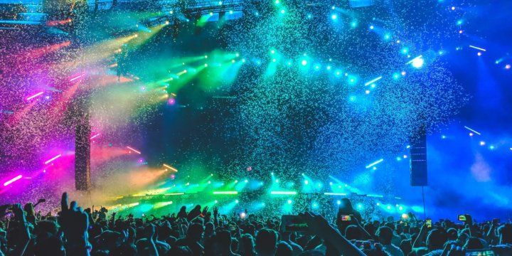 a concert with a very colorful lightshow