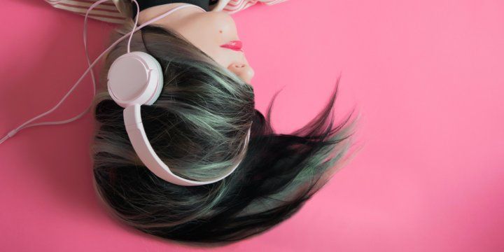 a girl with punky hair listening to headphones