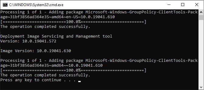 Command window showing the installation of gpedit.msc using the Enabler BAT file.