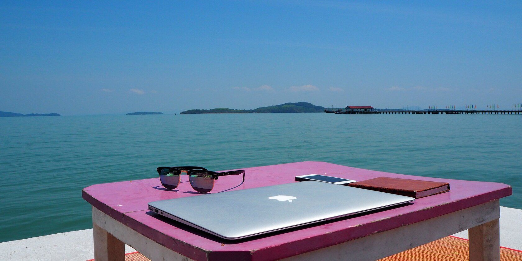 Computer sitting by the beach