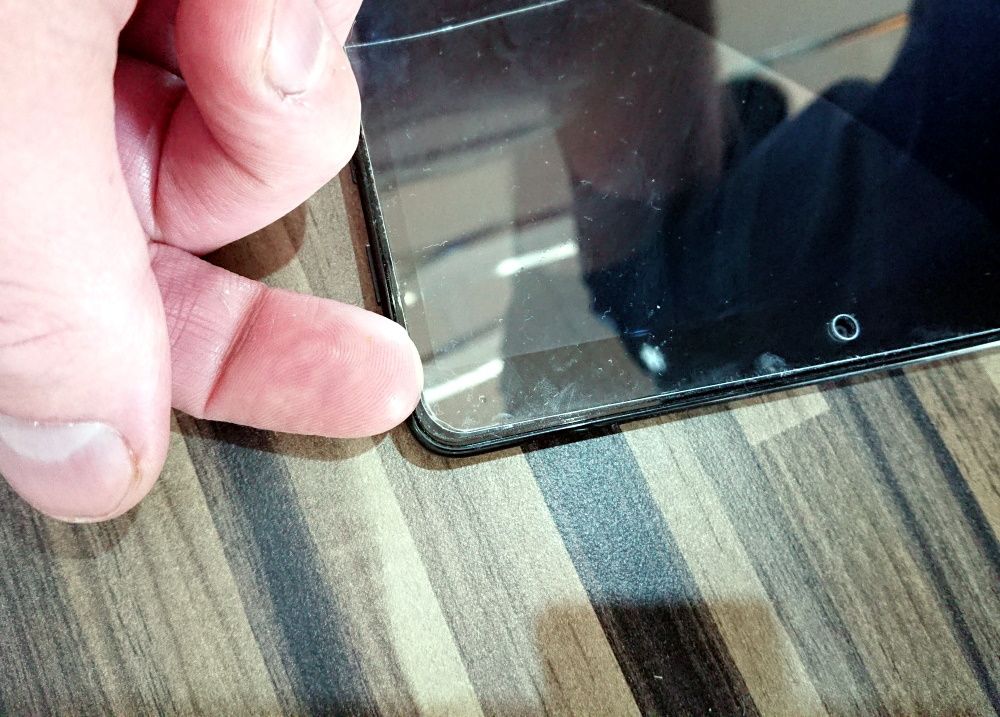 Remove a screen protector with your fingernail