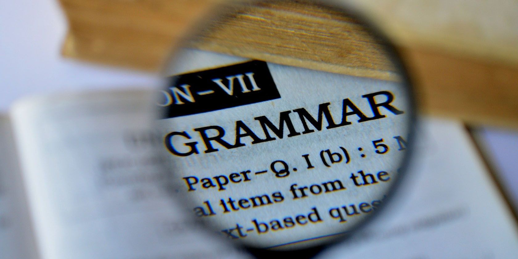 the word grammar viewed through a magnifying glass