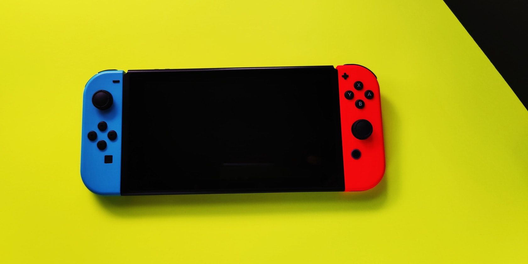 Nintendo Switch console with yellow background