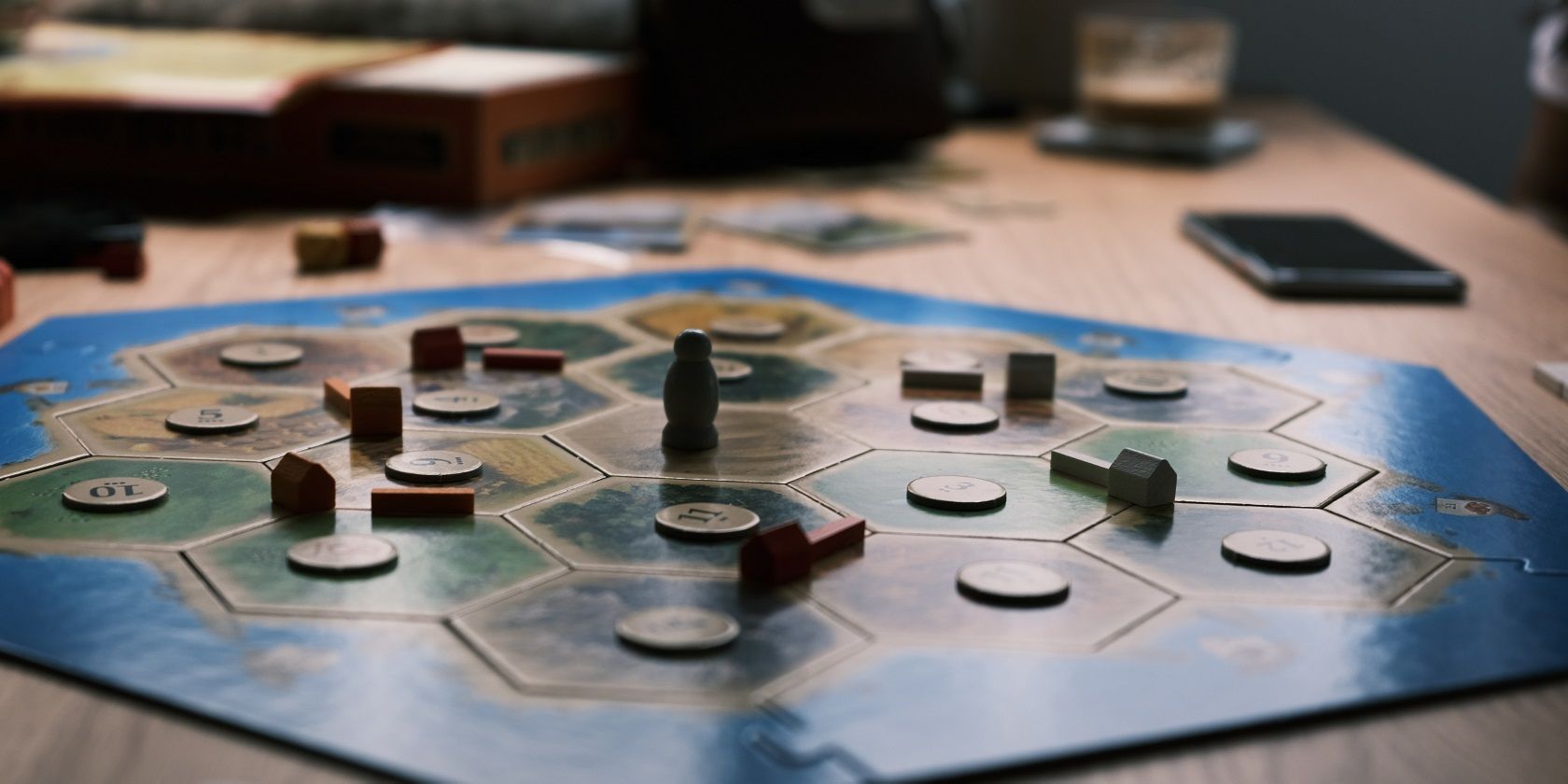 Catan Board Game and Cell Phone