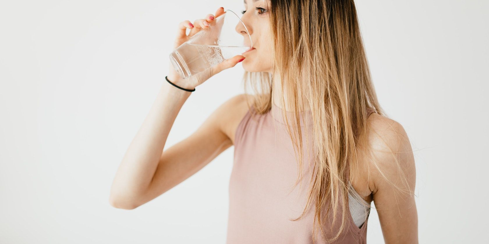 Woman in Pink Drinking Water w/ Right Hand