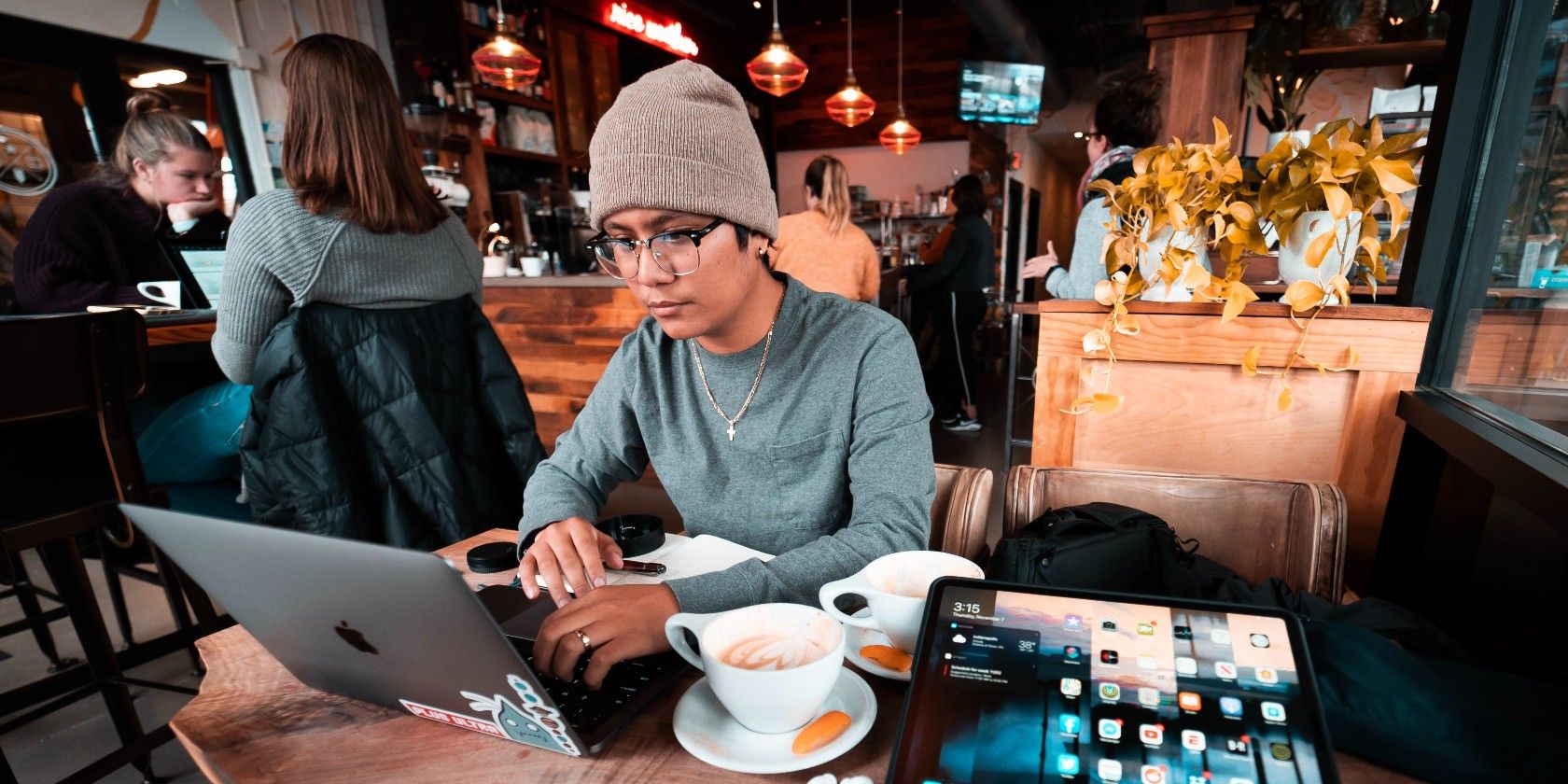 Person using a laptop in a coffee shop