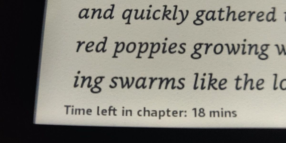 A Kindle with text and "Time left in chapter: 18mins" at the bottom of the screen