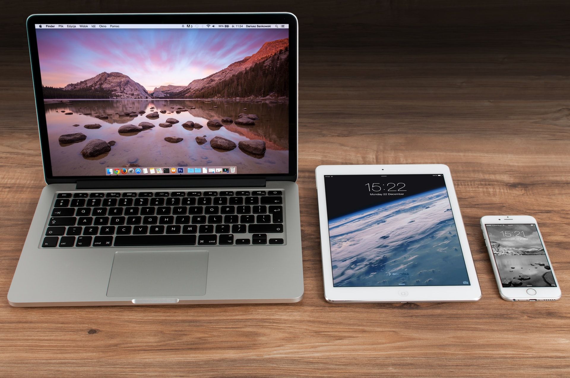 Laptop, tablet, and iphone on a table