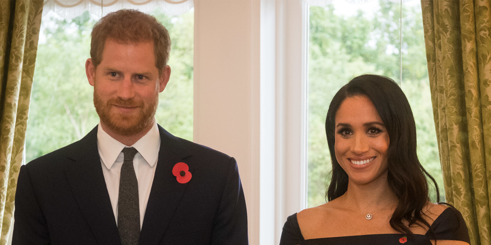 Prince Harry and Meghan Markle smile for a formal photo