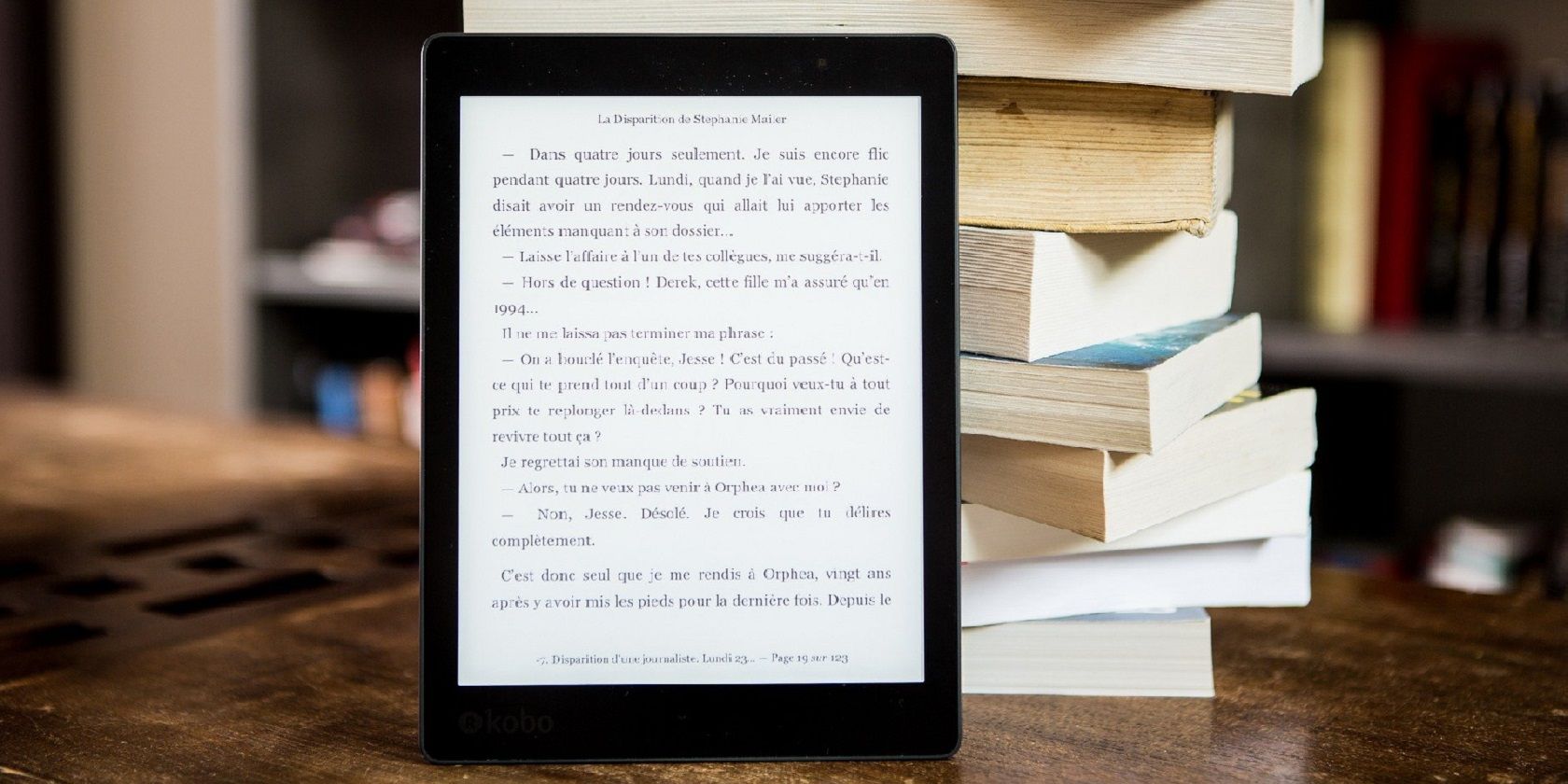 a tablet resting on a stack of books