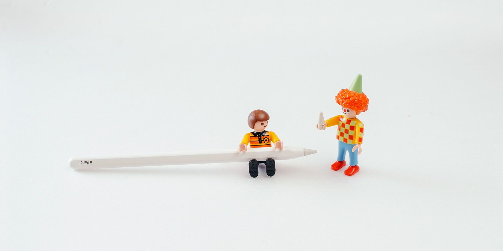 Lego Men Holding Apple Pencil