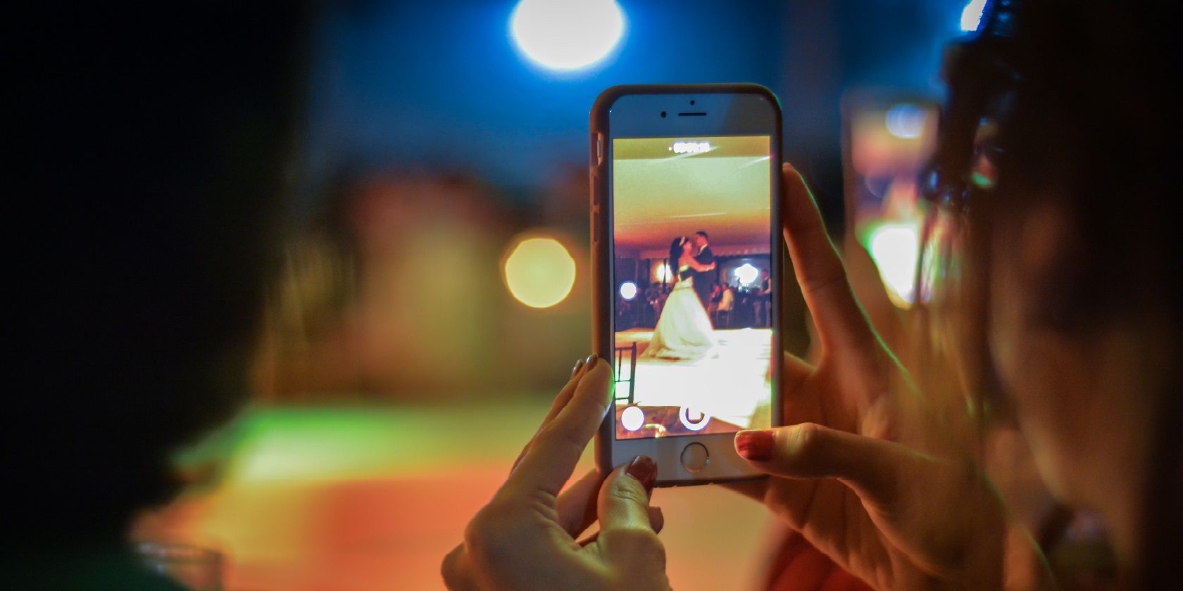 Close-up of Woman Using Mobile Phone at Night