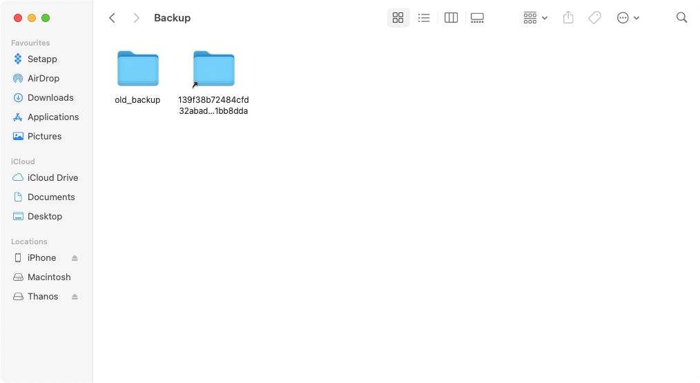 An iPhone Backup folder symlink in Finder.