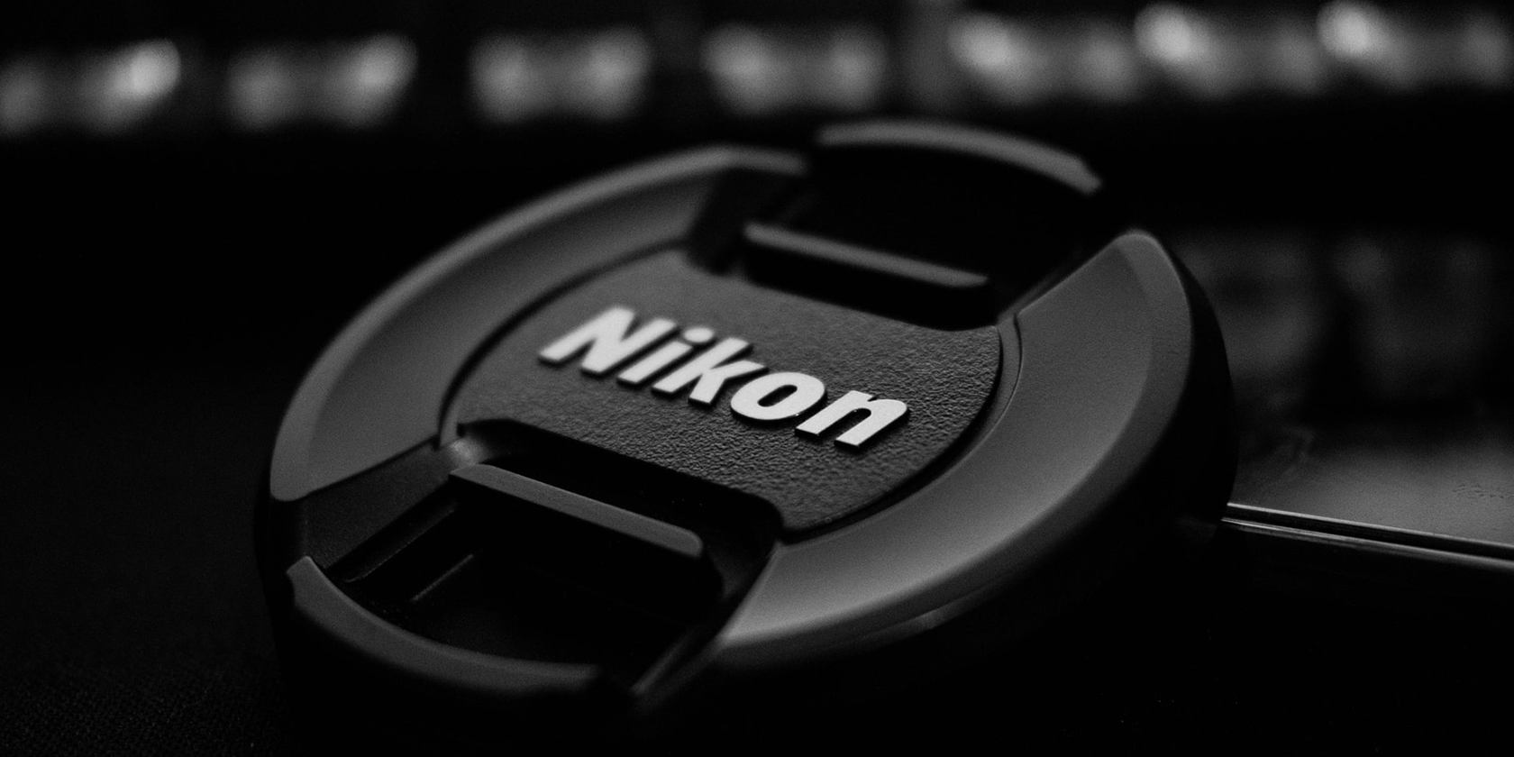 A Nikon-branded camera lens cap
