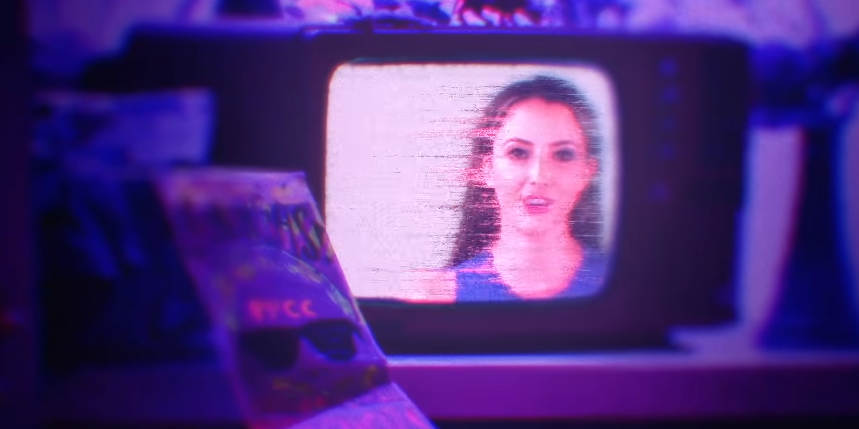 Taryn Southern on a purple television box