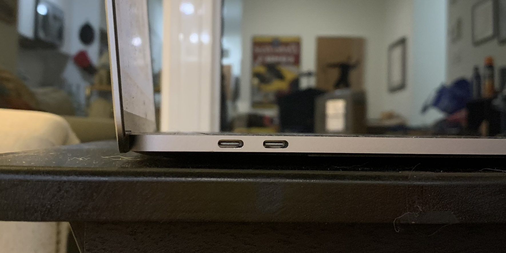 The view of two USB-C ports on the side of a 2017 MacBook Pro