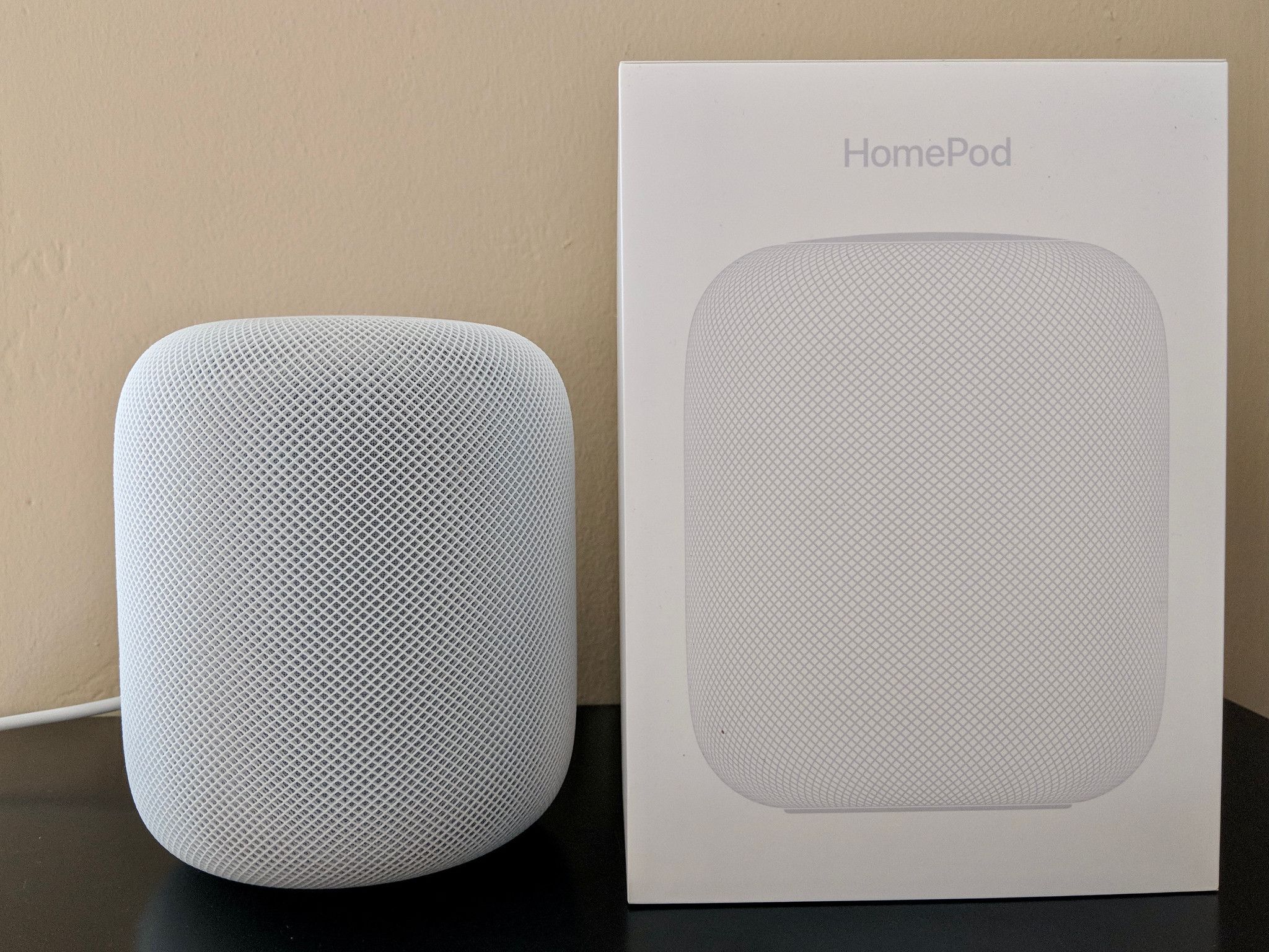 White HomePod with its box