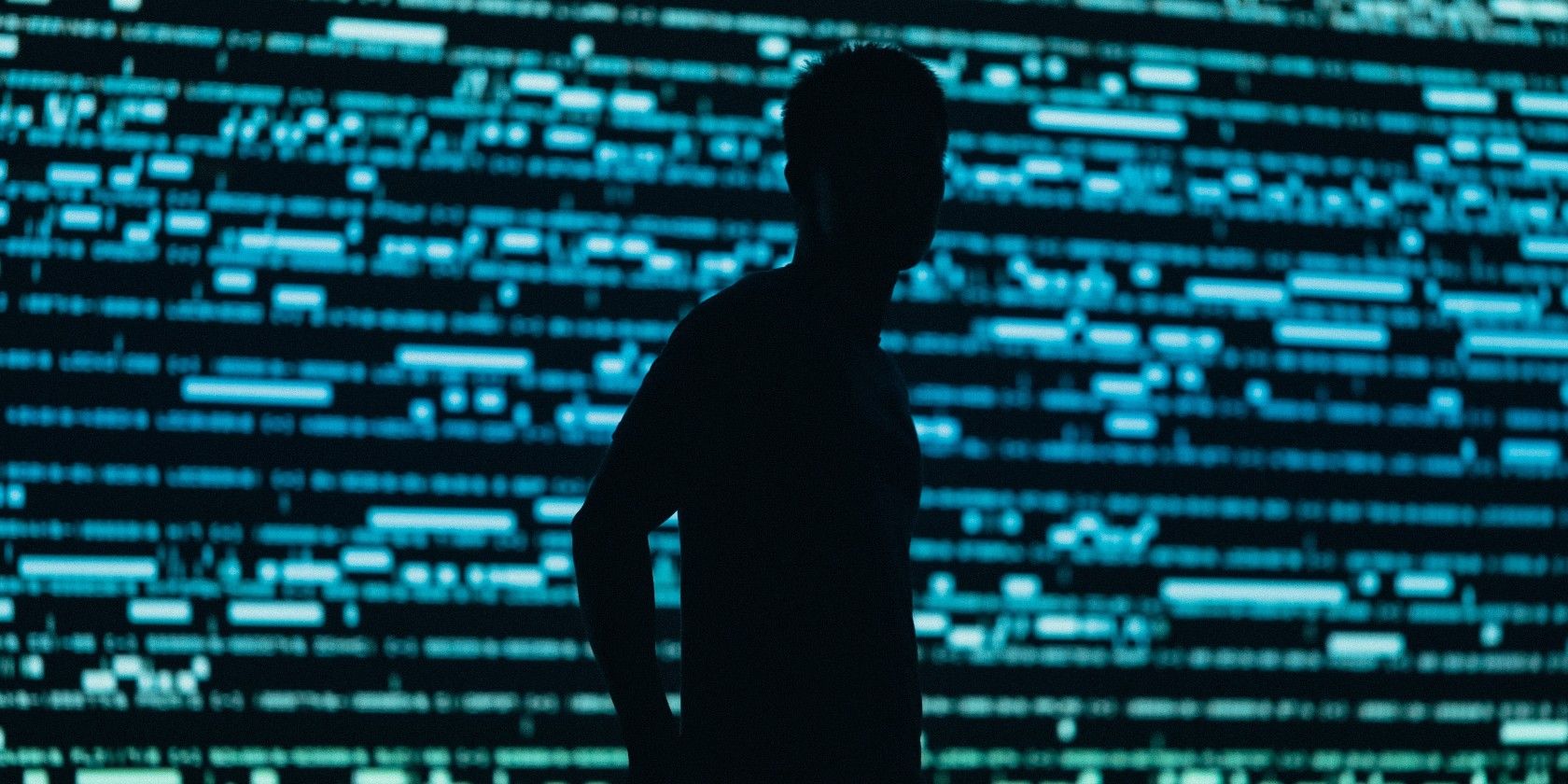 man standing behind data backdrop