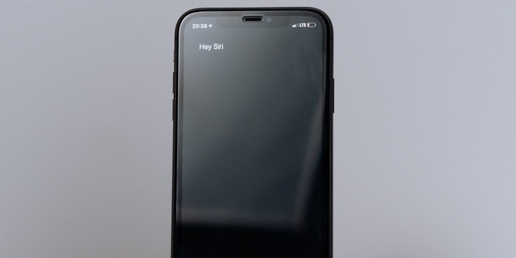 A photo of the iPhone with the Hey Siri prompt.