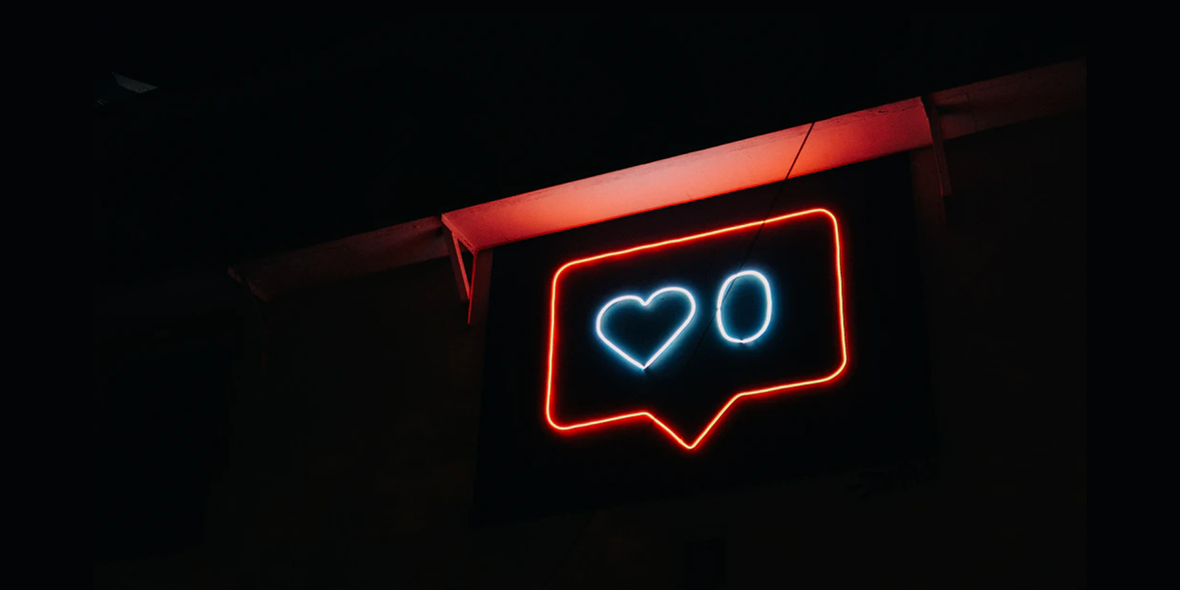 A neon sign of the Instagram like icon