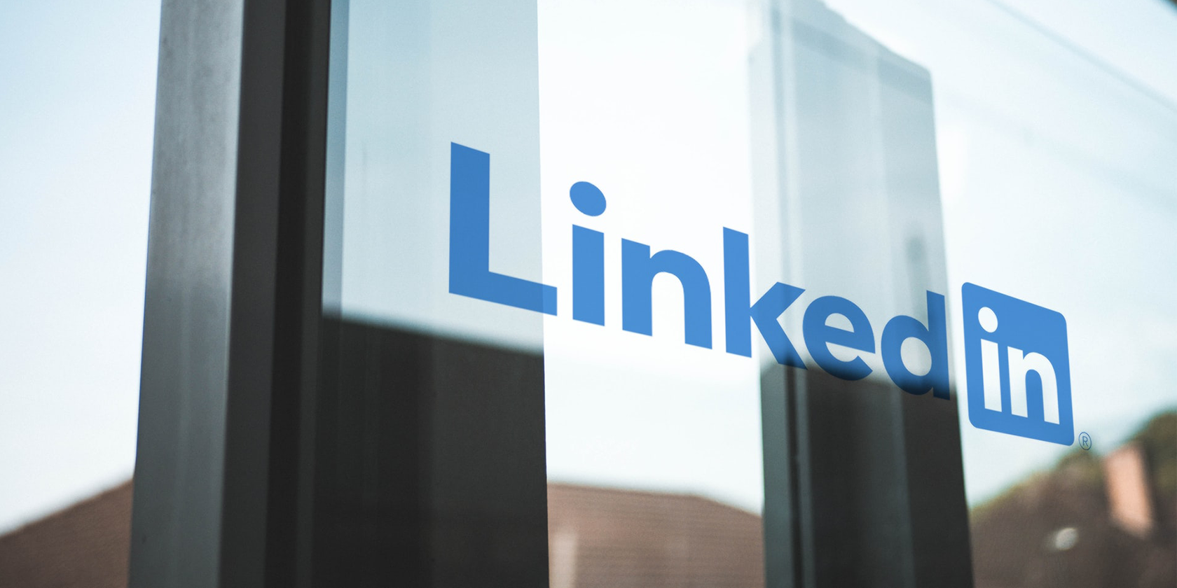 The LinkedIn logo printed on a window