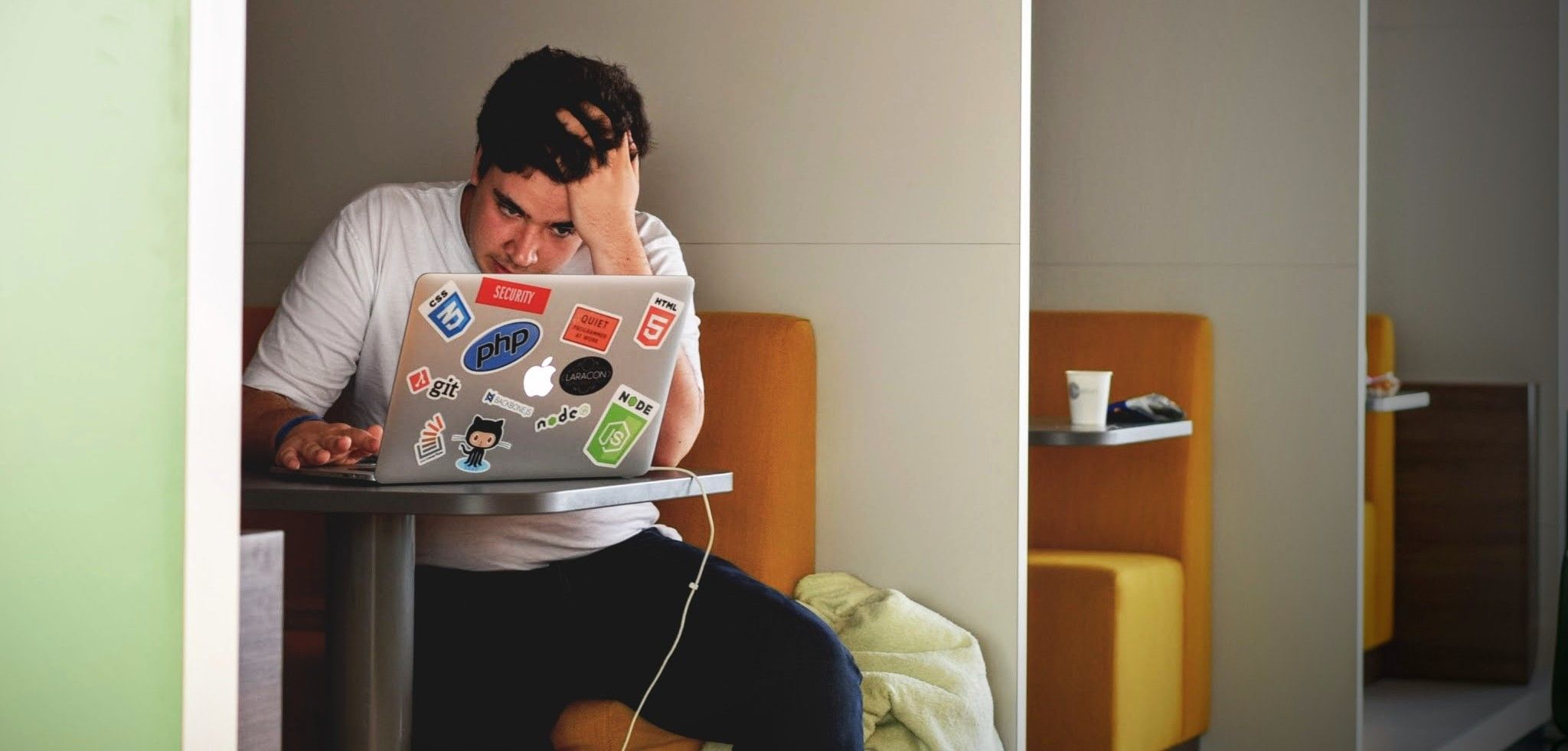 a stressed out person in front of a laptop