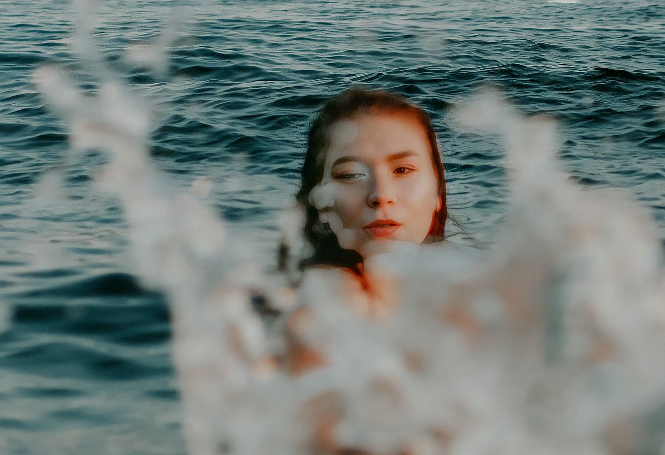 person swimming in an ocean