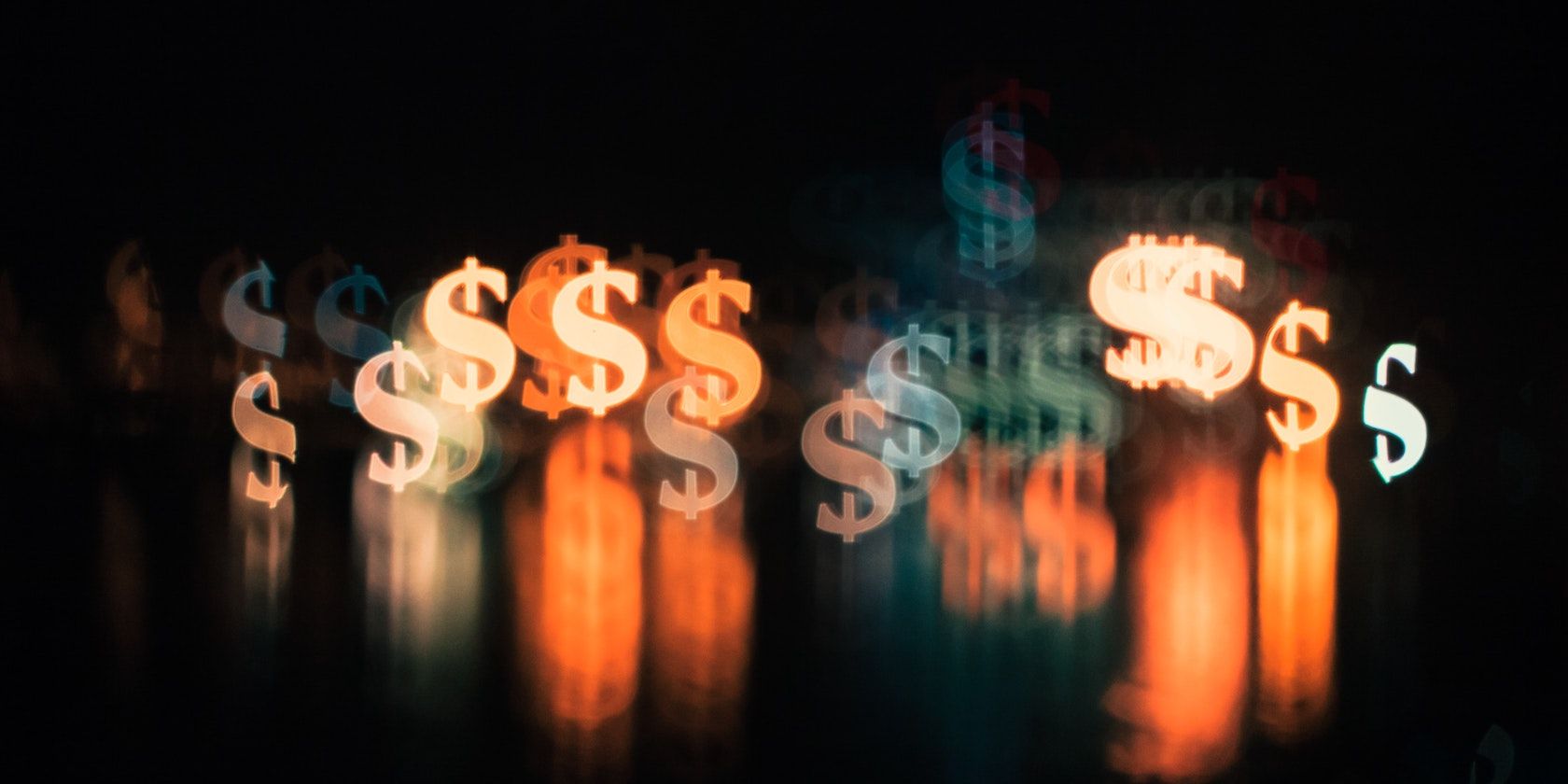 A series of blurred, glowing dollar symbols in reference to jQuery's dollar function